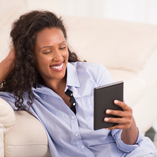 Woman reading eReader image