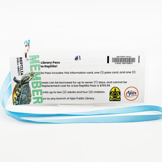 A Reptilia Pass on a light blue lanyard.